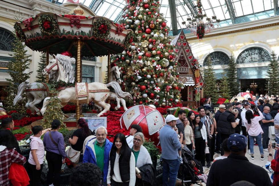 Guests take in ‘Twas holiday flower display at Bellagio Conservatory & Botanical Gar ...