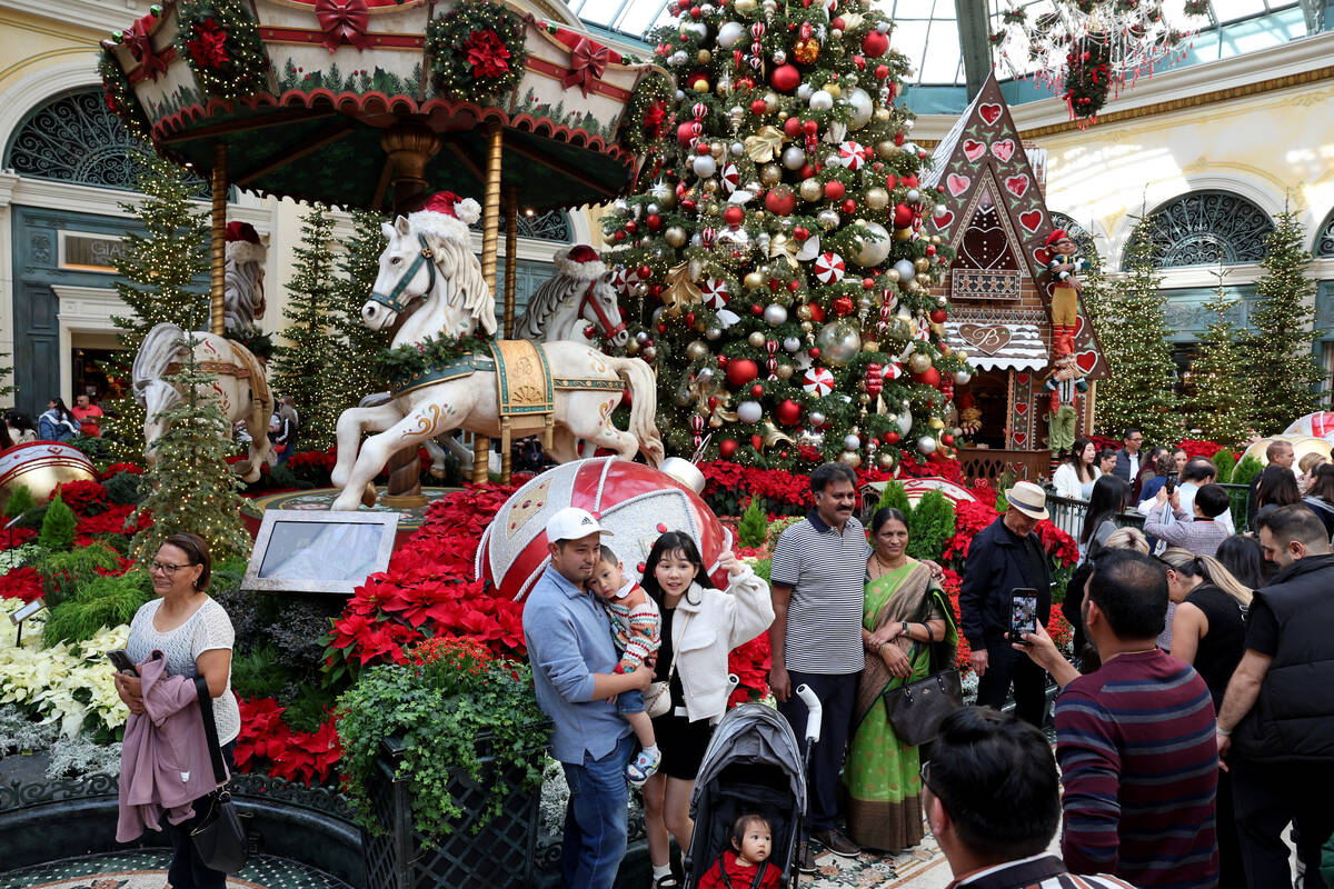 Guests take in ‘Twas holiday flower display at Bellagio Conservatory & Botanical Gar ...