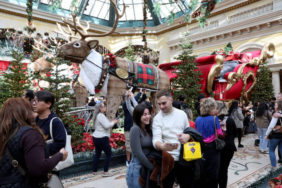 Sofia Giacomomi and Santino De parasis of Argentina take a selfie in ‘Twas holiday flowe ...