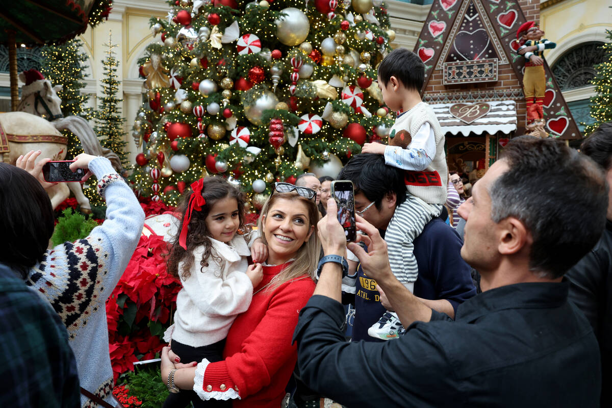 Guests take in ‘Twas holiday flower display at Bellagio Conservatory & Botanical Gar ...