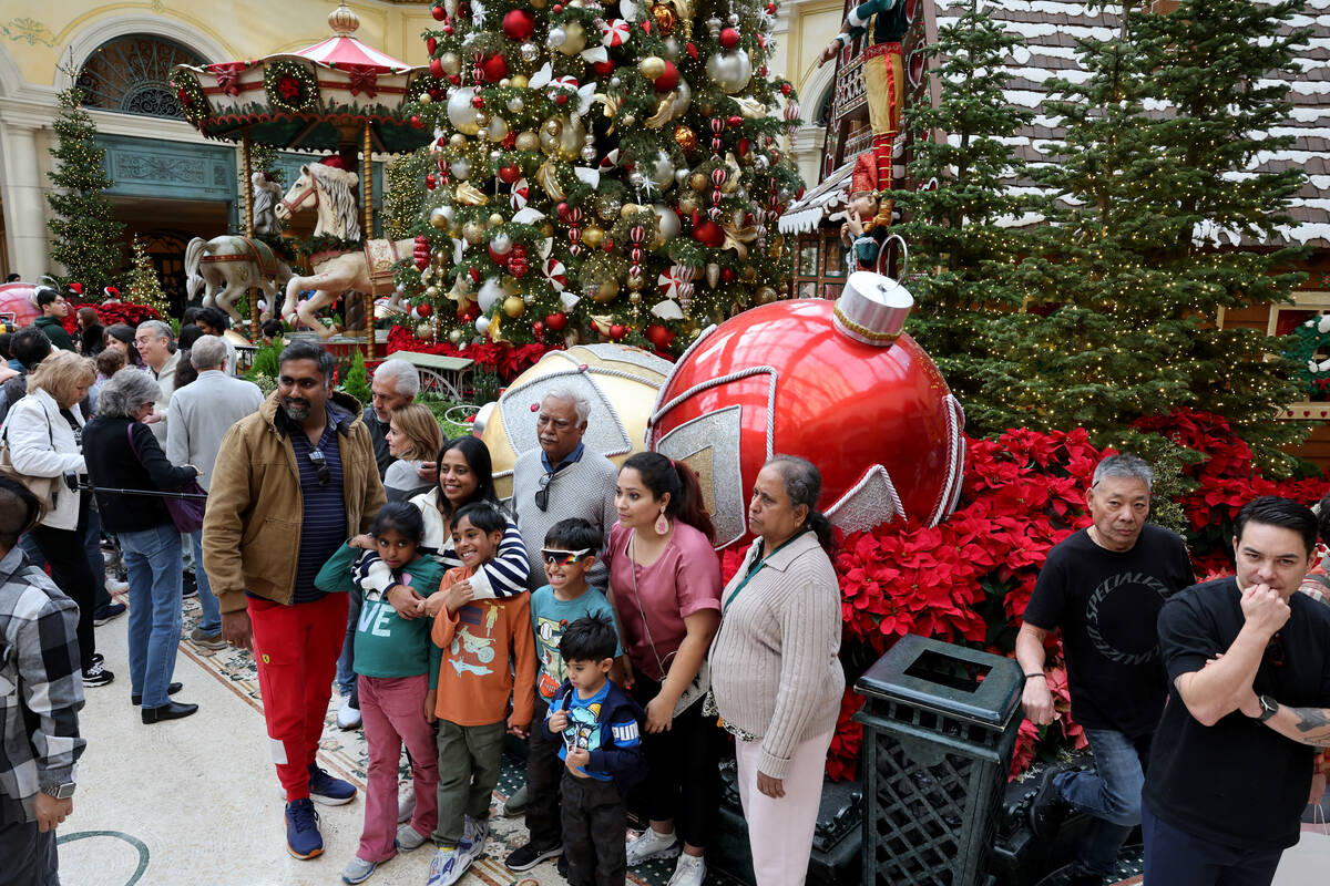 Guests take in ‘Twas holiday flower display at Bellagio Conservatory & Botanical Gar ...