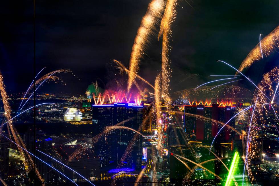 Fireworks erupt over the Las Vegas Strip as part of New Years Eve festivities across the city f ...