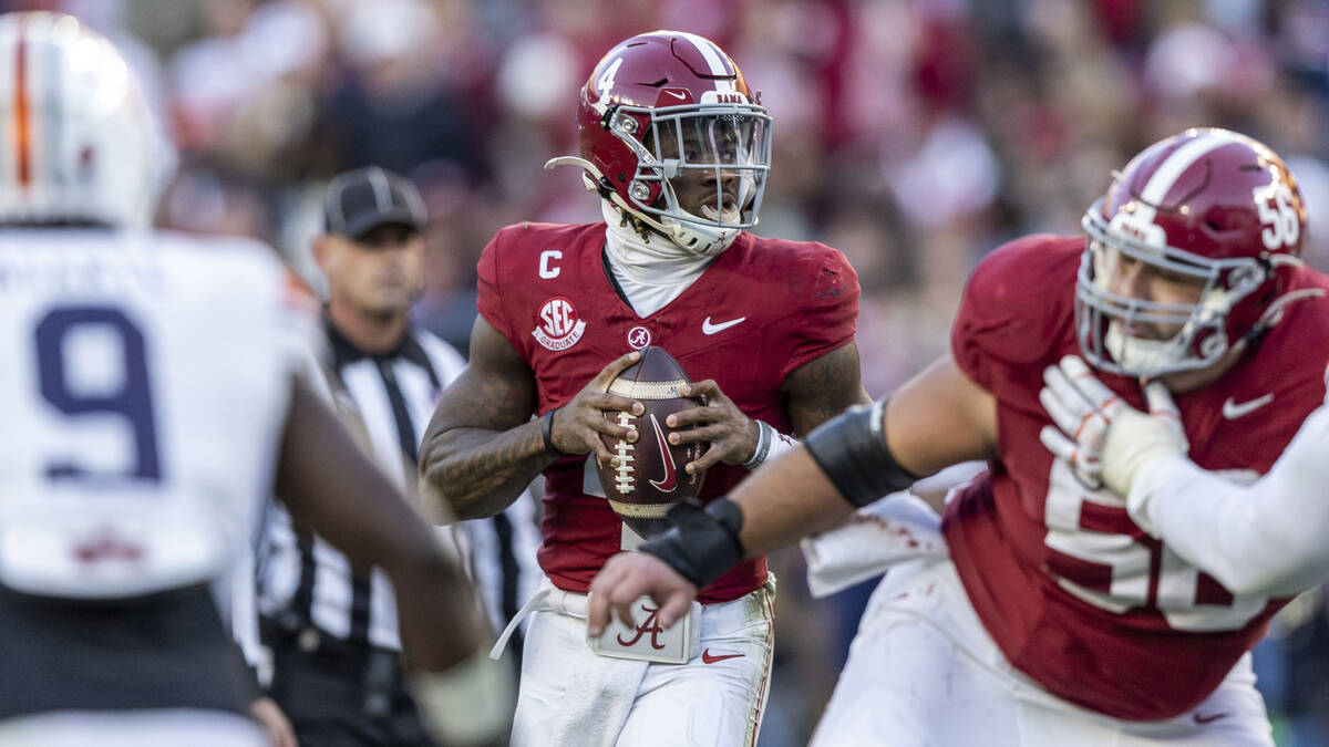 Alabama quarterback Jalen Milroe (4) surveys the field during the first half of an NCAA college ...