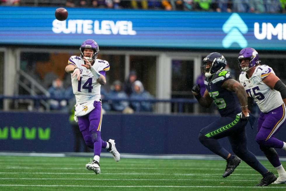 Minnesota Vikings quarterback Sam Darnold throws against the Seattle Seahawks during an NFL foo ...