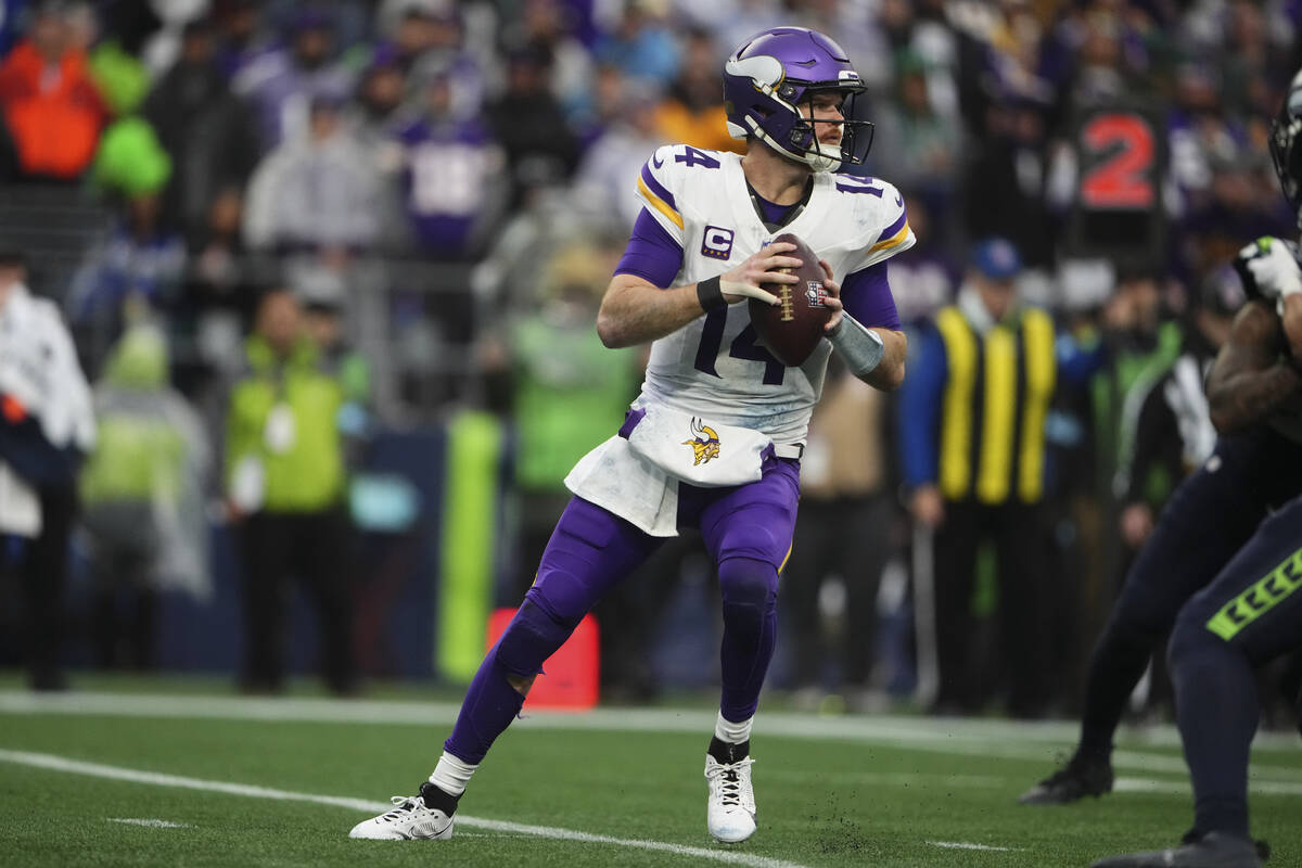 Minnesota Vikings quarterback Sam Darnold looks to throw against the Seattle Seahawks during an ...