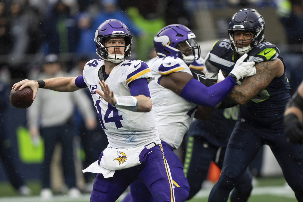 Minnesota Vikings quarterback Sam Darnold passes the ball during an NFL football game against t ...