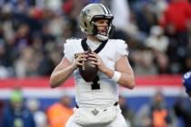 New Orleans Saints quarterback Derek Carr (4) looks to pass the ball during an NFL football gam ...