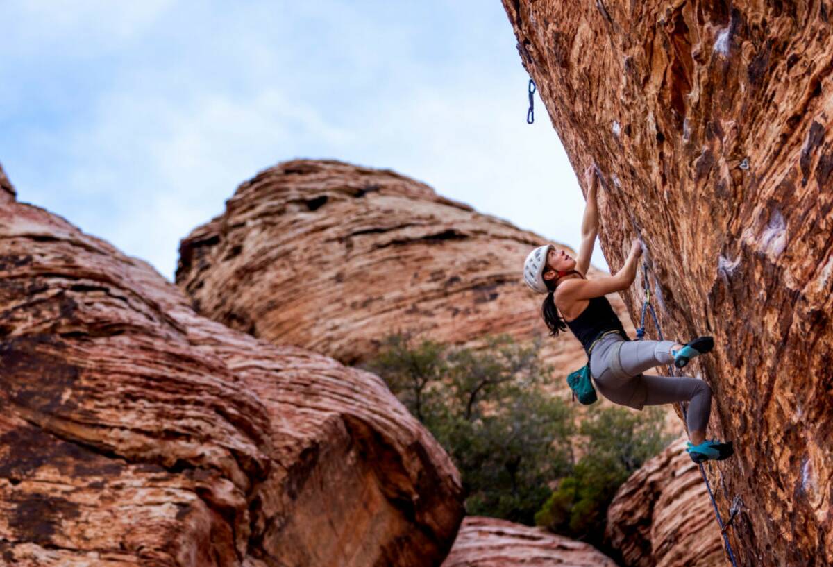 Rock climber Devin Pinaroc of Nanaimo, B.C. works her way up a large boulder in Calico Basin on ...