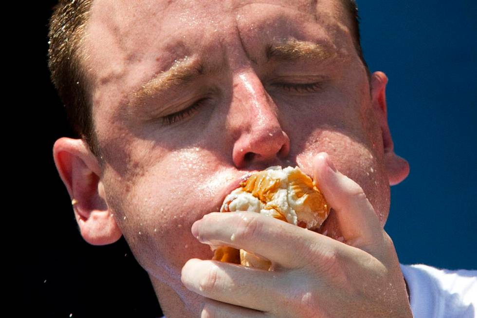 FILE - Five-time reigning champion Joey Chestnut competes in the Nathan's Famous Hot Dog Eating ...