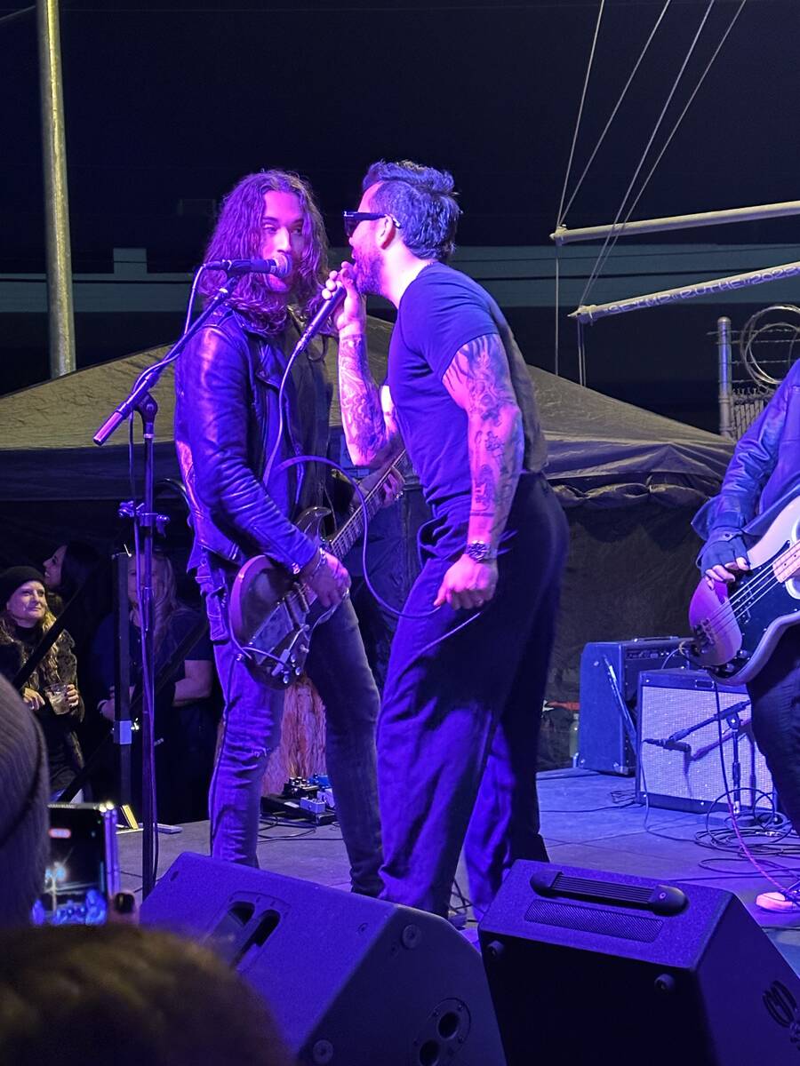 Frankie Sidoris, left, and vocalist Franky Perez jam with Slash at the reopening of Hard Hat Lo ...