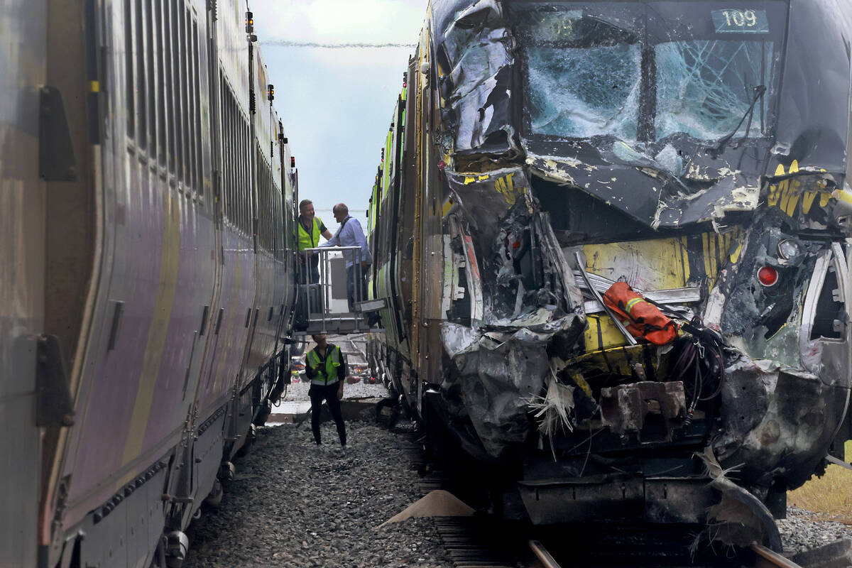 A damaged Brightline train is seen after it collided with a fire truck in downtown Delray Beach ...