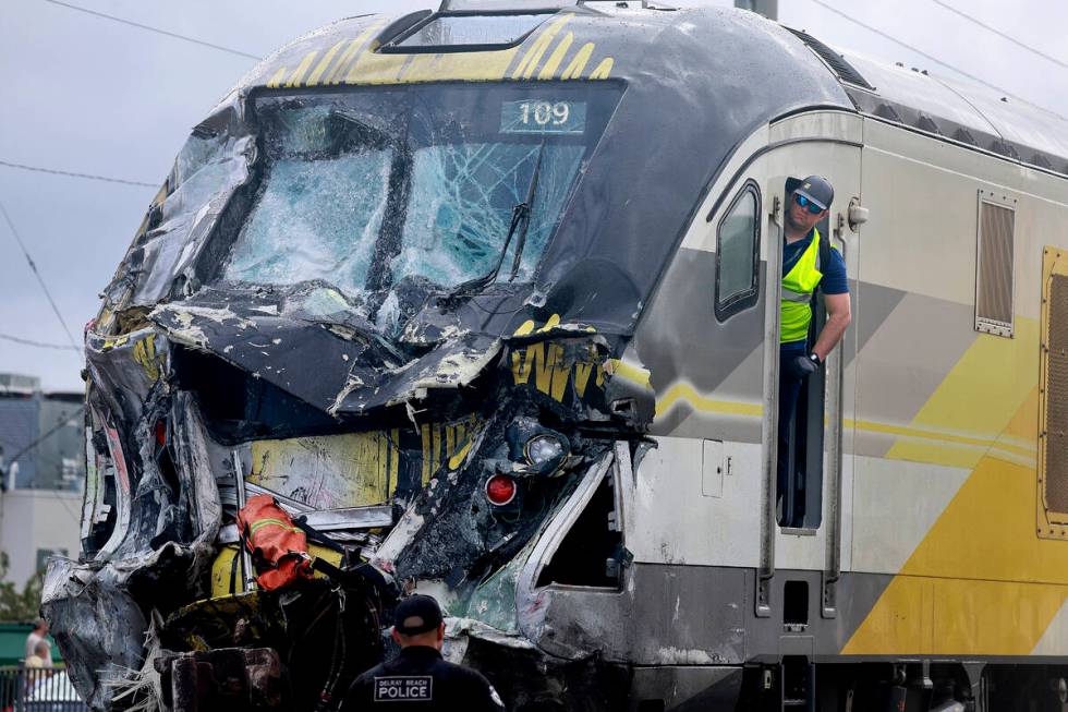 A damaged Brightline train is seen after it collided with a fire truck in downtown Delray Beach ...