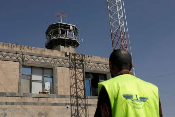 A man looks at the damage in the control tower of Sana'a International Airport following Thursd ...