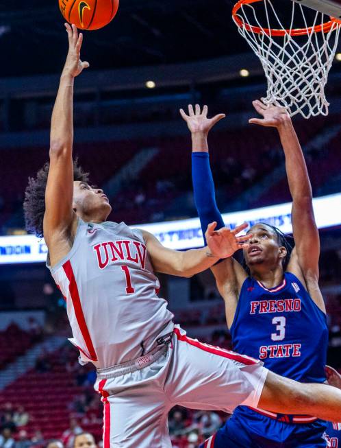 UNLV forward Jalen Hill (1) releases a shot over Fresno State Bulldogs forward Elijah Price (3) ...