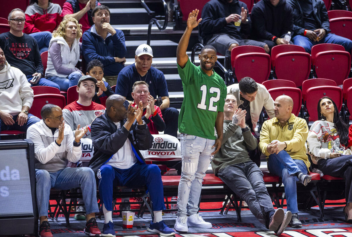 UNLV football quarterback Hajj-Malik Williams is applauded as they battle the Fresno State Bull ...