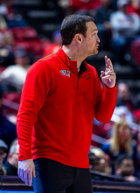 UNLV head coach Kevin Kruger signals to his players against the Fresno State Bulldogs during th ...