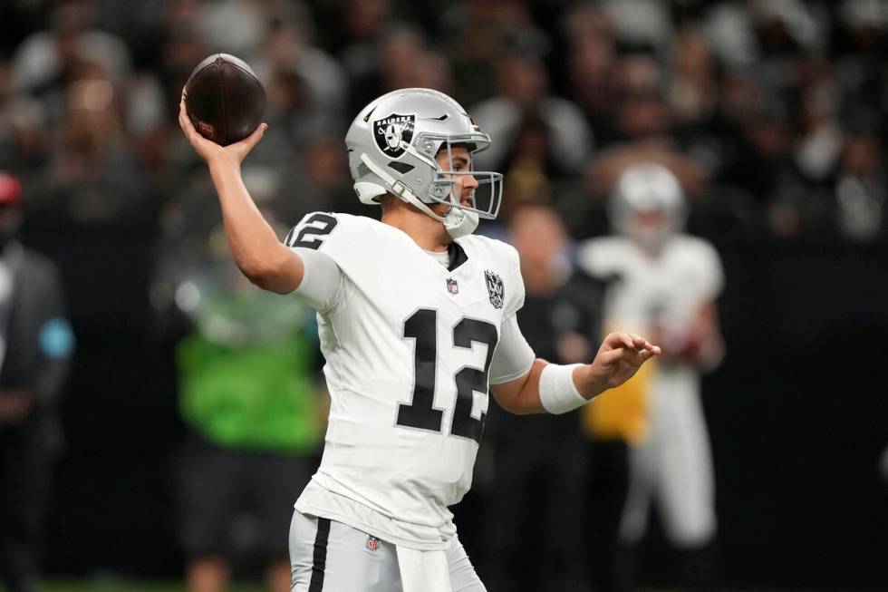 Las Vegas Raiders quarterback Aidan O'Connell throws a pass during the first half of an NFL foo ...