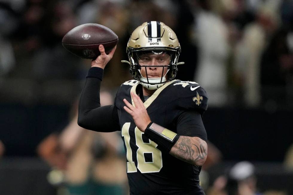 New Orleans Saints quarterback Spencer Rattler throws a pass during the first half of an NFL fo ...