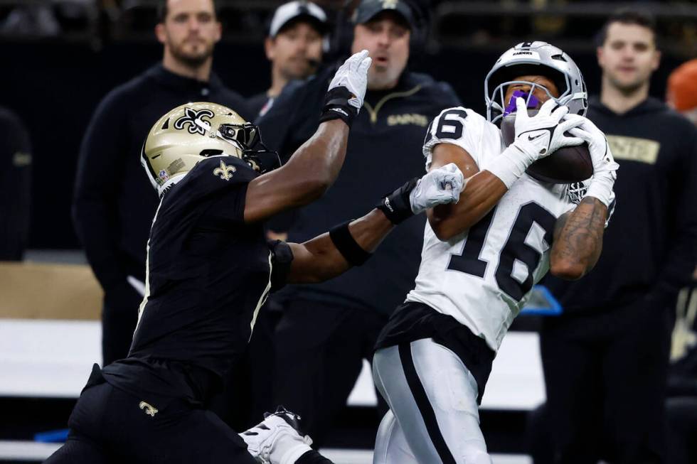 Las Vegas Raiders wide receiver Jakobi Meyers (16) catches a pass in front of New Orleans Saint ...