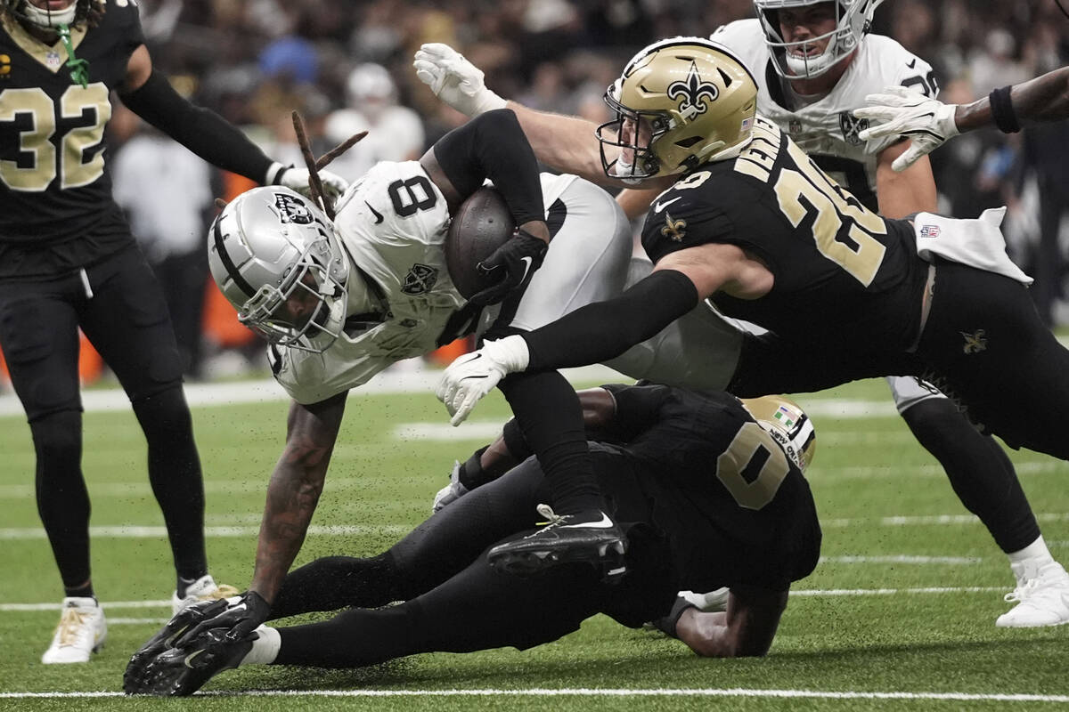 Las Vegas Raiders running back Ameer Abdullah (8) is tackled by New Orleans Saints linebacker P ...