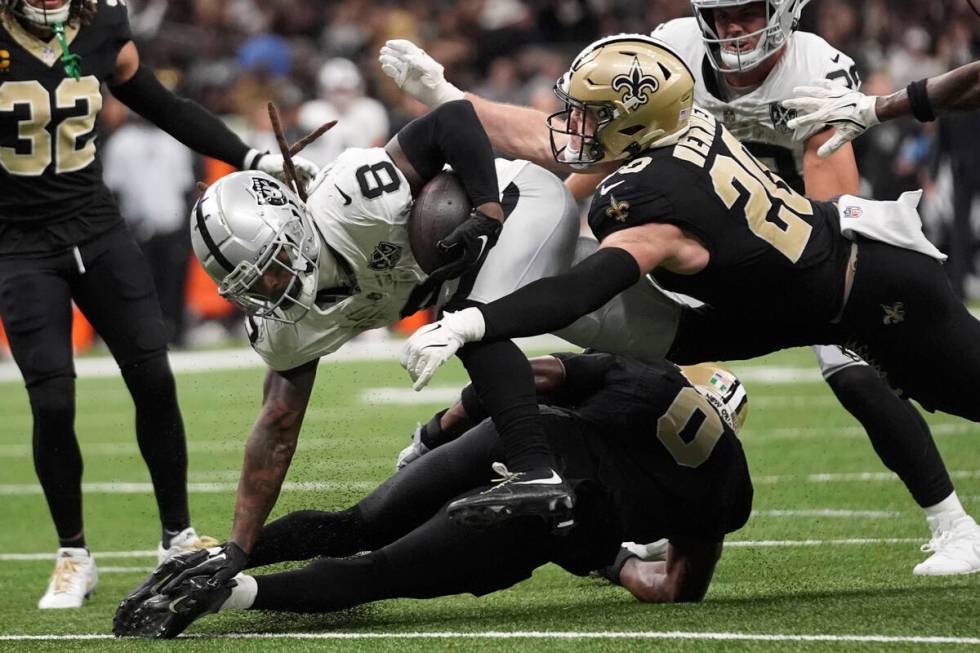 Las Vegas Raiders running back Ameer Abdullah (8) is tackled by New Orleans Saints linebacker P ...