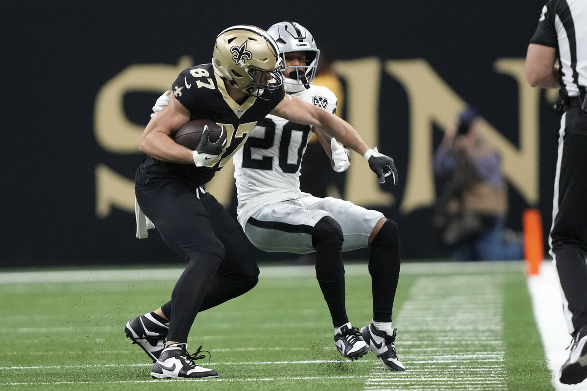 New Orleans Saints tight end Foster Moreau (87) catches a pass in front of Las Vegas Raiders sa ...