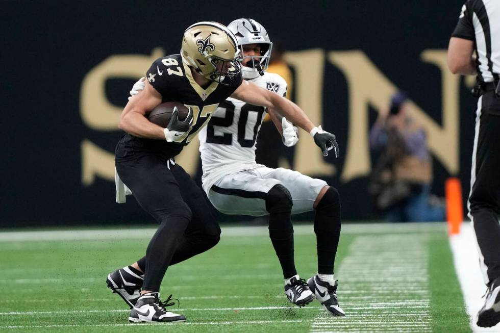 New Orleans Saints tight end Foster Moreau (87) catches a pass in front of Las Vegas Raiders sa ...