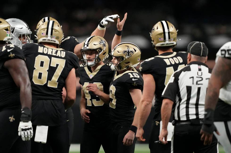 New Orleans Saints place kicker Blake Grupe celebrates with teammates after kicking a 34-yard f ...