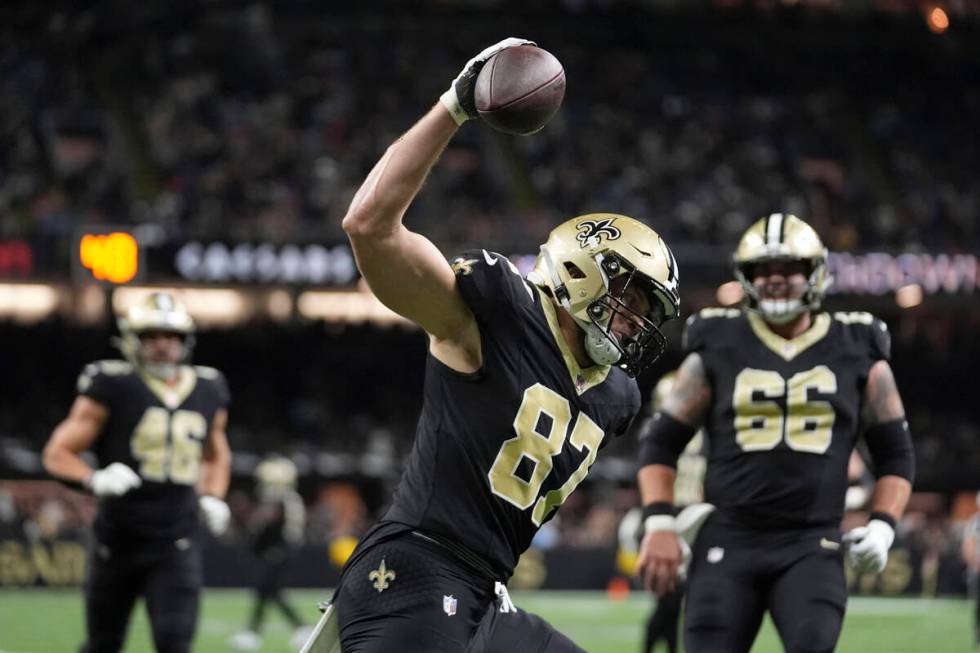 New Orleans Saints tight end Foster Moreau (87) celebrates after catching a 30-yard touchdown p ...