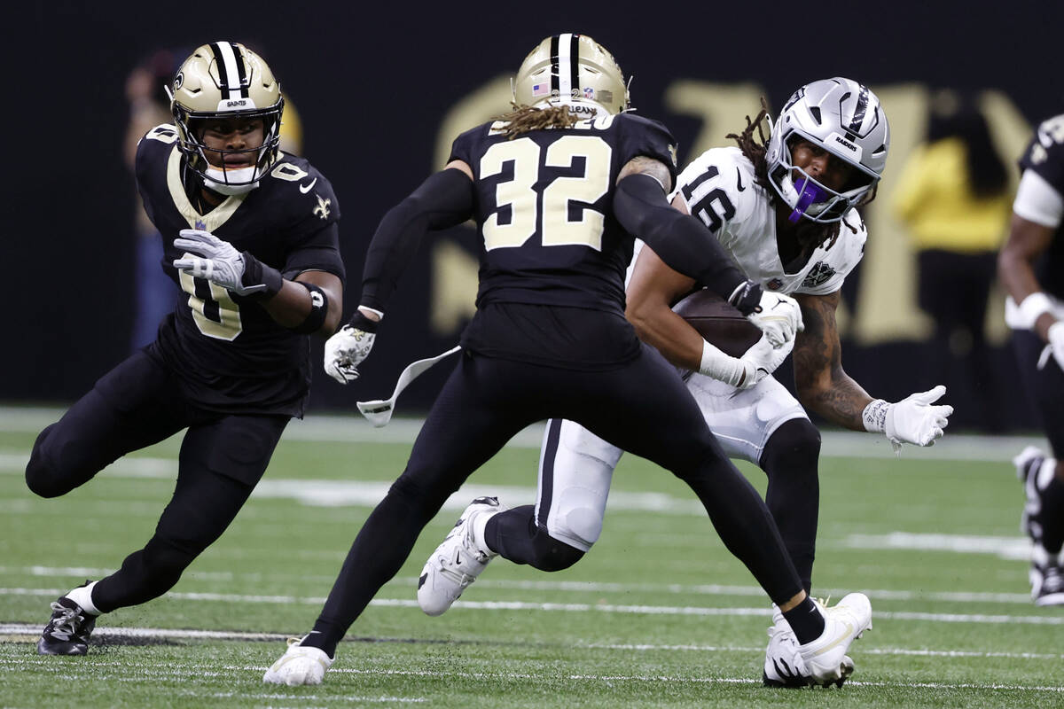 Las Vegas Raiders wide receiver Jakobi Meyers (16) runs from New Orleans Saints safety Tyrann M ...