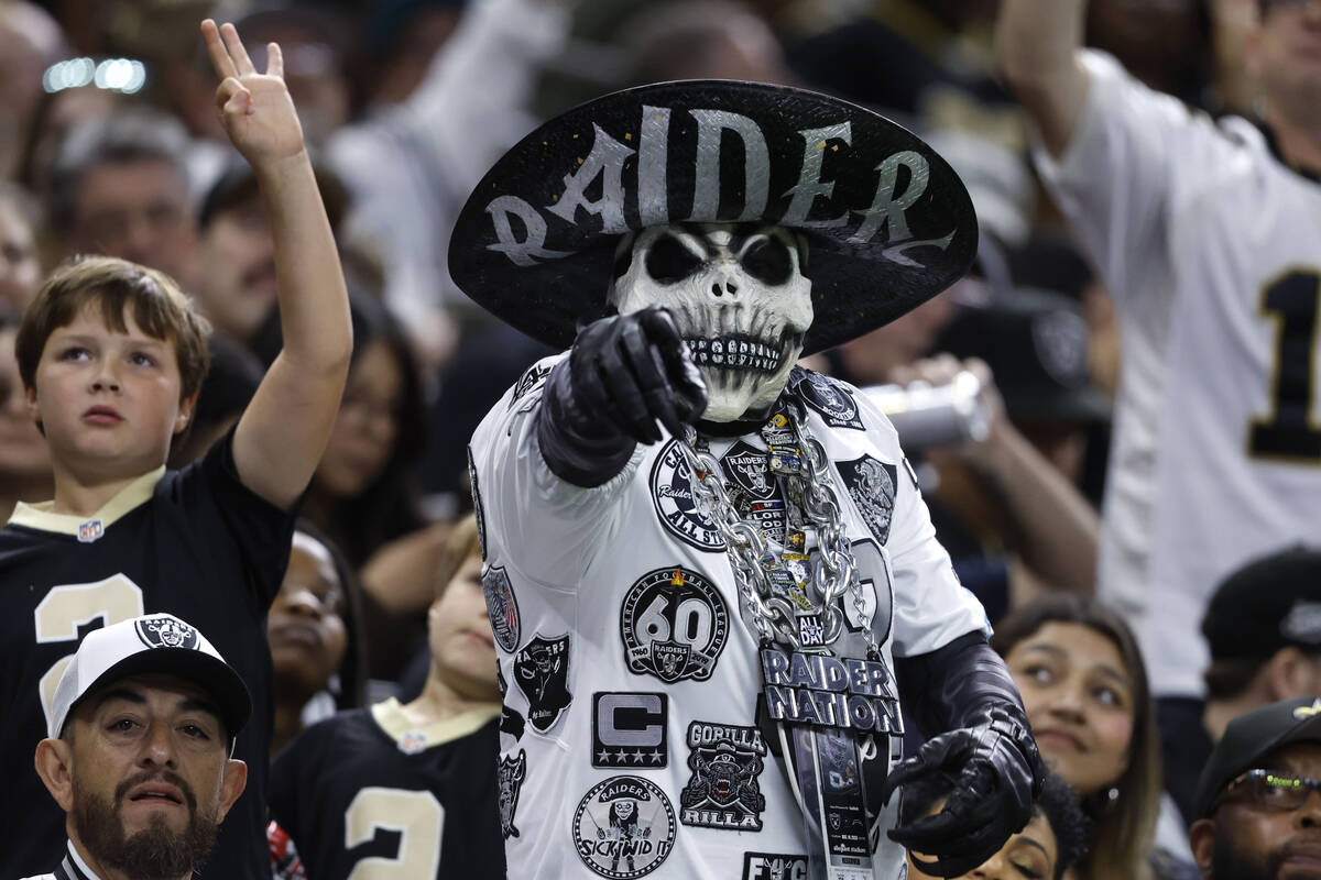 Fans cheer during the second half of an NFL football game between the New Orleans Saints and th ...