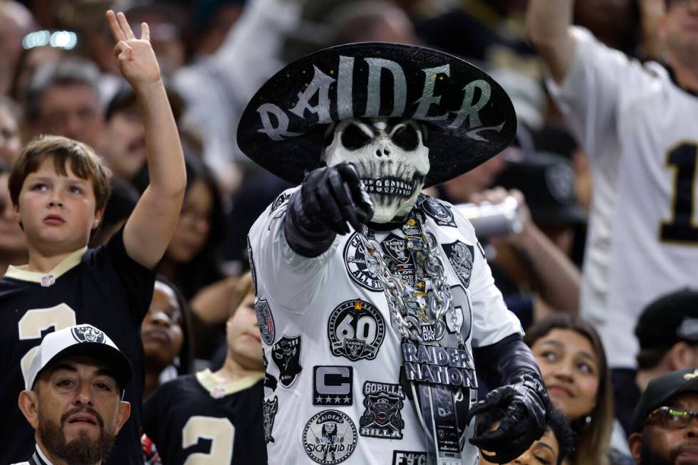 Fans cheer during the second half of an NFL football game between the New Orleans Saints and th ...