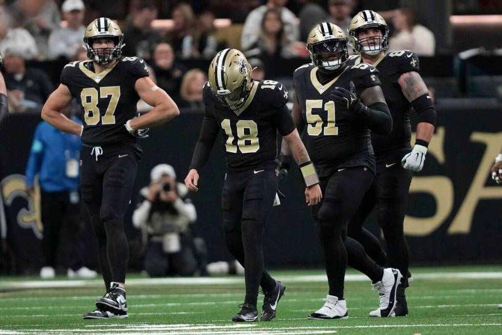 New Orleans Saints quarterback Spencer Rattler (18) walks off the field after getting sacked du ...