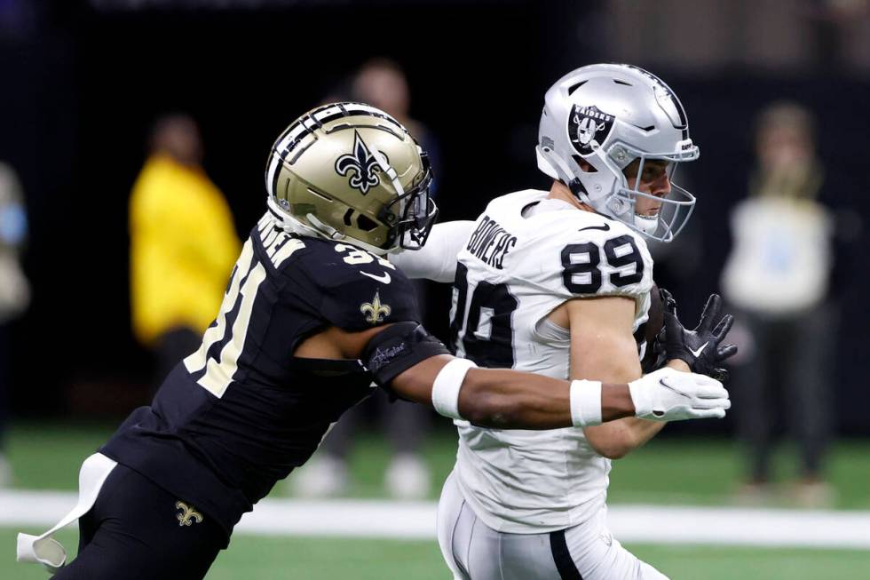 Las Vegas Raiders tight end Brock Bowers (89) catches a pass for a first down in front of New O ...