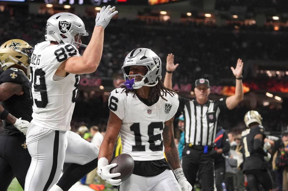 Las Vegas Raiders wide receiver Jakobi Meyers (16) celebrates with teammate tight end Brock Bow ...