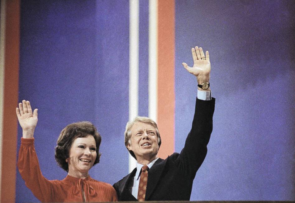 FILE - Jimmy Carter and his wife, Rosalynn, wave to supporters at the Democratic National Conve ...