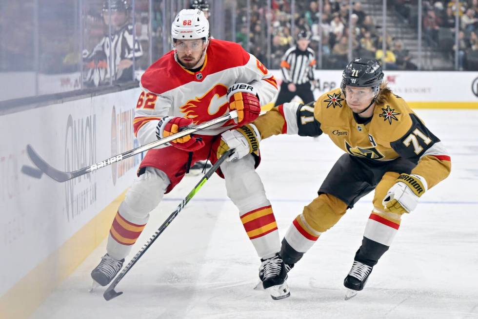 Calgary Flames defenseman Daniil Miromanov (62) and Vegas Golden Knights center William Karlsso ...