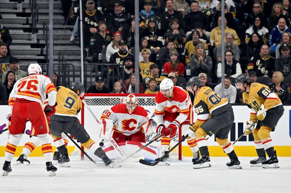 Vegas Golden Knights center Jack Eichel (9) shoots against Calgary Flames goaltender Dan Vladar ...