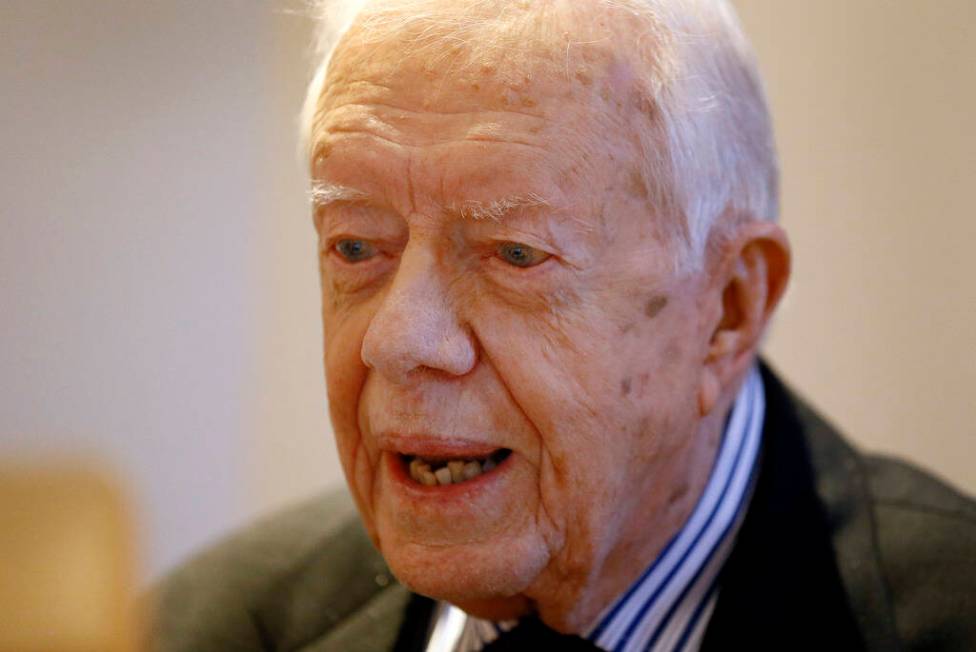 FILE - Former US President Jimmy Carter listens during a video interview with the Associated Pr ...