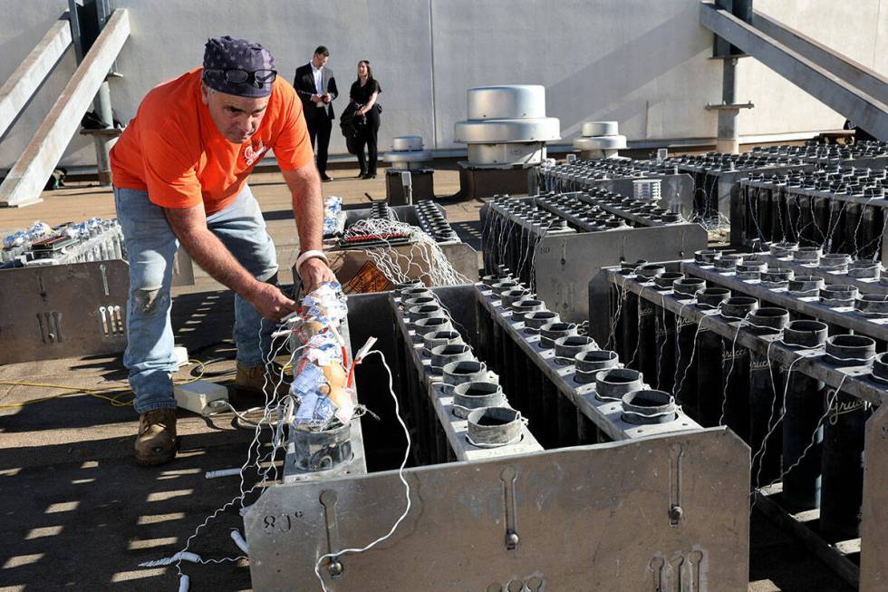 Fireworks by Grucci pyro technician and crew chief Louis DeLeo prepares shells while setting up ...