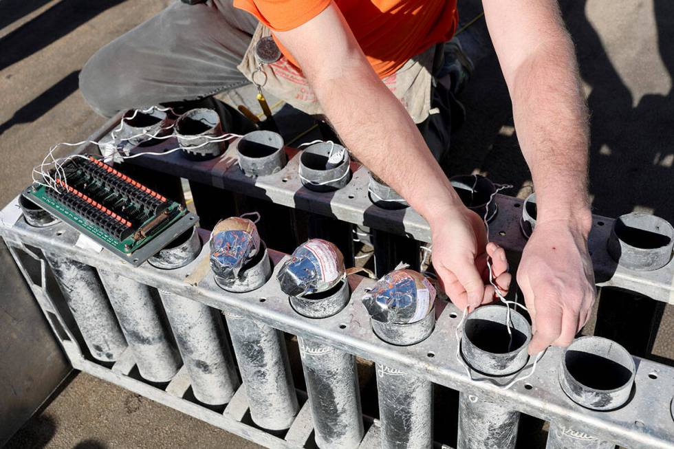 Fireworks by Grucci pyro technician Fred Muller prepares shells while setting up for America’ ...