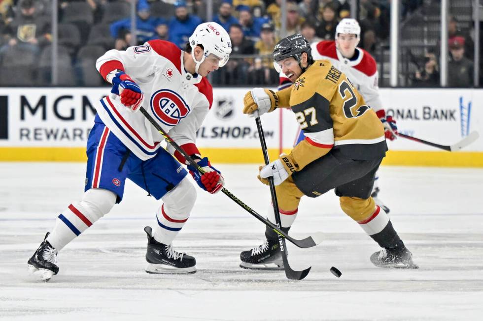 Montreal Canadiens left wing Juraj Slafkovsky (20) and Vegas Golden Knights defenseman Shea The ...