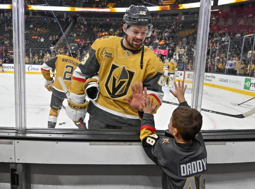 Vegas Golden Knights center Tomas Hertl (48) greets his son during warms up before an NHL hocke ...