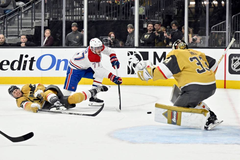 Montreal Canadiens center Kirby Dach (77) shoots and scores against Vegas Golden Knights defens ...