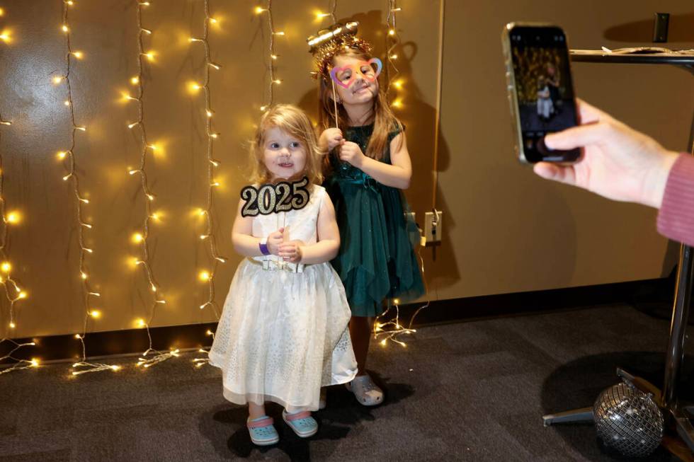 Jordyn Nelson 2, and her sister Kendall Nelson 5, pose during “Noon Year’s Eve&#x ...