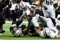 Las Vegas Raiders running back Ameer Abdullah (8) is tackled by New Orleans Saints defensive en ...