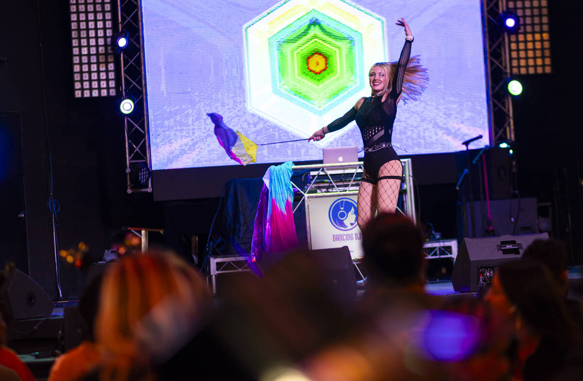 A DJ dances for the crowd during the New Year's Eve celebration at the Fremont Street Experienc ...