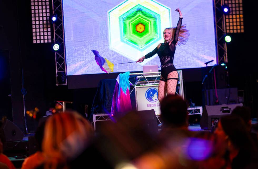 A DJ dances for the crowd during the New Year's Eve celebration at the Fremont Street Experienc ...