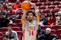 UNLV guard Jailen Bedford (14) attempts a three-point shot during the second half of the colleg ...