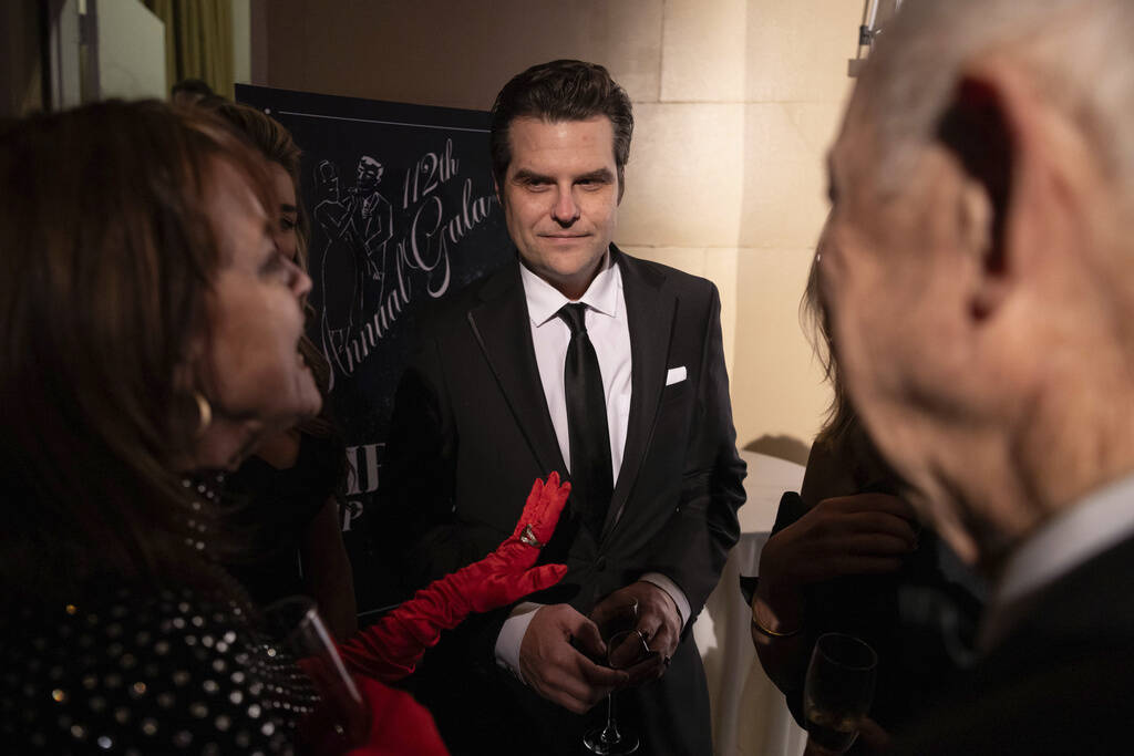 Former Rep. Matt Gaetz, R-Fla., center, attends the cocktail hour of the New York Young Republi ...